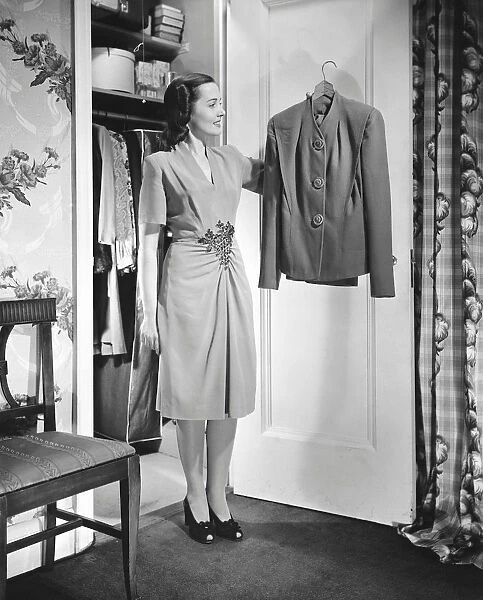 Woman selecting clothing