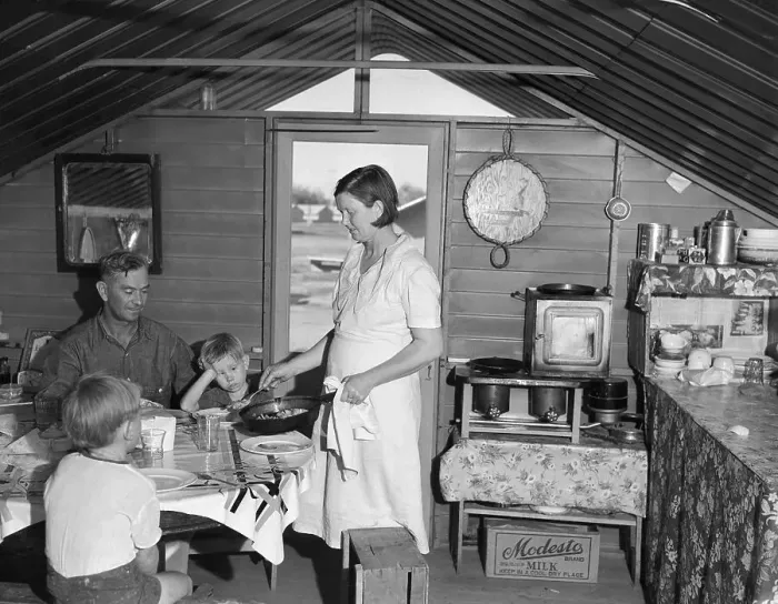 Framed Print : Woman Serves Family Dinner In Clean Home Framed Print : Woman Serves Family Dinner In Clean Home