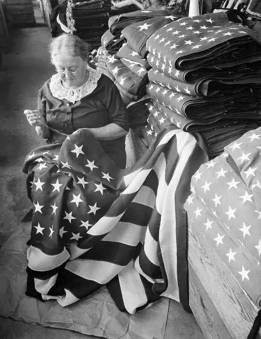 Framed Print : Woman Sewing Stars on Custom Flag Framed Print : Woman Sewing Stars on Custom Flag