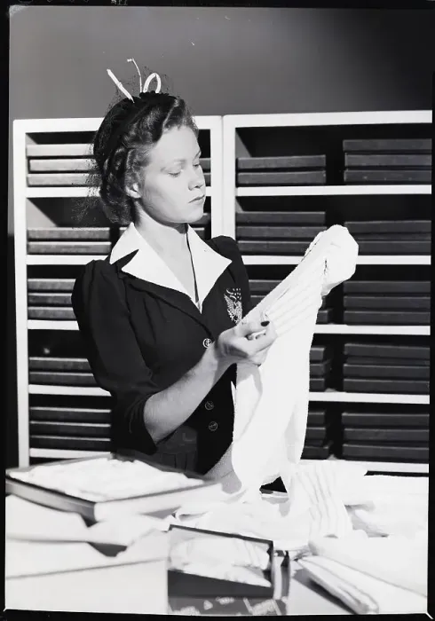 Framed Print : Woman Shopper Examining Towel Framed Print : Woman Shopper Examining Towel