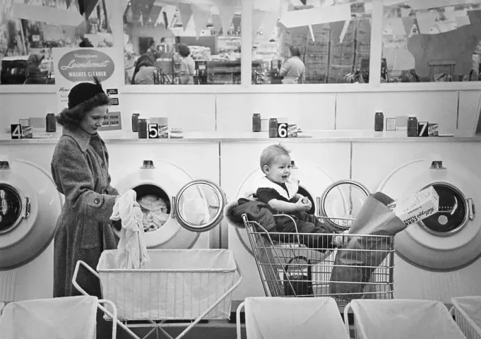 Framed Print : Woman Shopping While Doing Laundry Framed Print : Woman Shopping While Doing Laundry