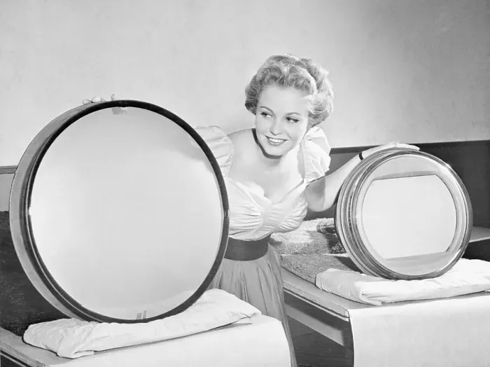 Framed Print : Woman Showing New Television Sets Framed Print : Woman Showing New Television Sets