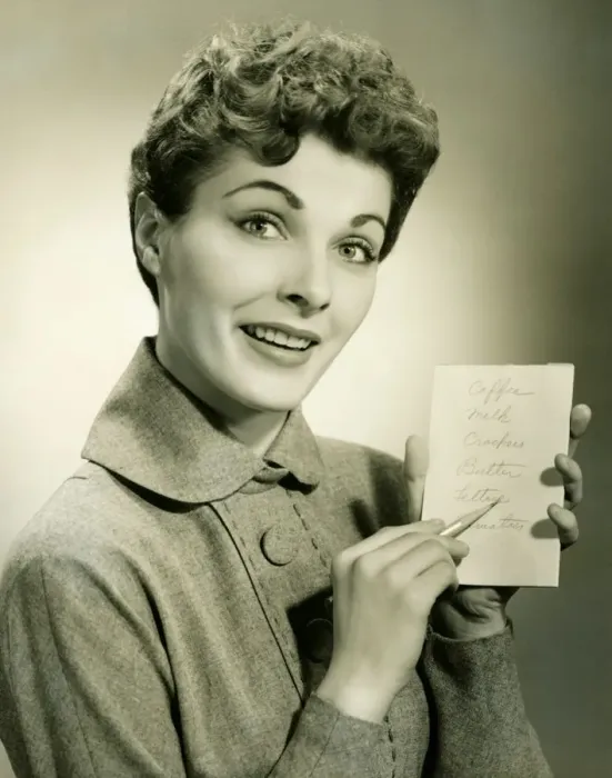 Framed Print : Woman showing shopping list in studio, (B&W), portrait Framed Print : Woman showing shopping list in studio, (B&W), portrait