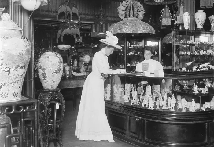Framed Print : Woman Signing Card In Curio Shop Framed Print : Woman Signing Card In Curio Shop