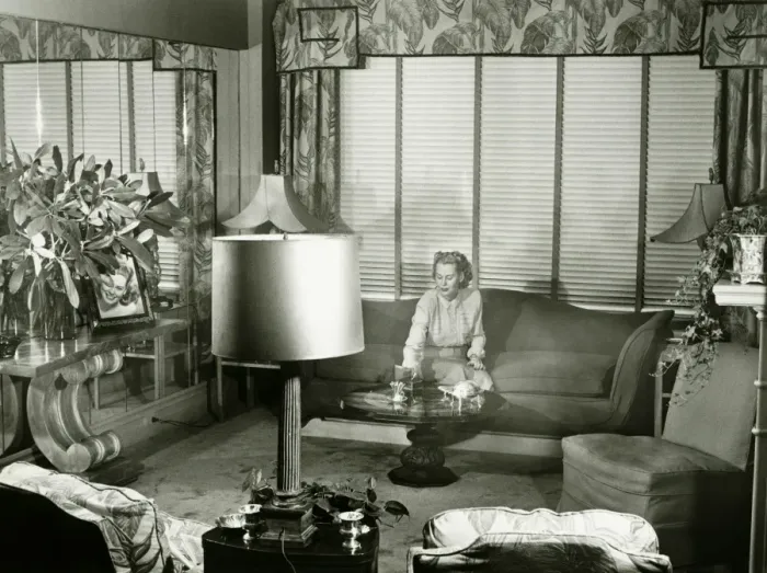 Framed Print : Woman sitting on couch in opulent living room, (B&W) Framed Print : Woman sitting on couch in opulent living room, (B&W)