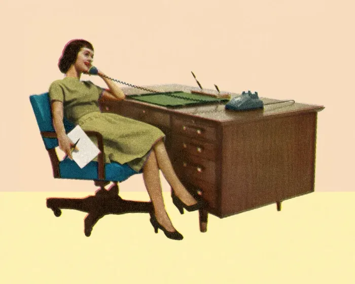 Framed Print : Woman Sitting at Desk Talking on Phone Framed Print : Woman Sitting at Desk Talking on Phone