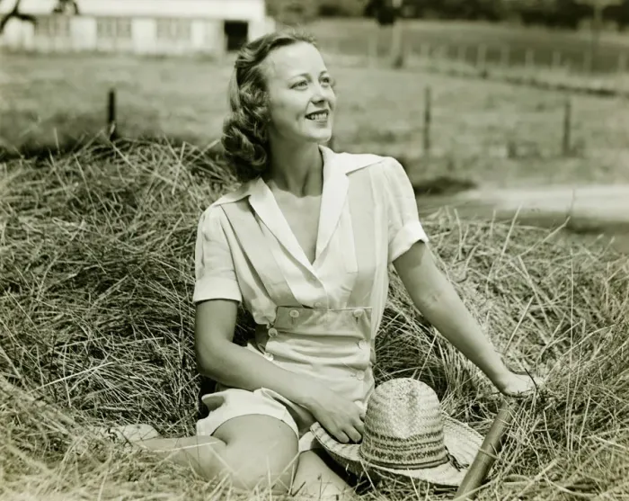 Framed Print : Woman sitting on haystack, (B&W), portrait Framed Print : Woman sitting on haystack, (B&W), portrait