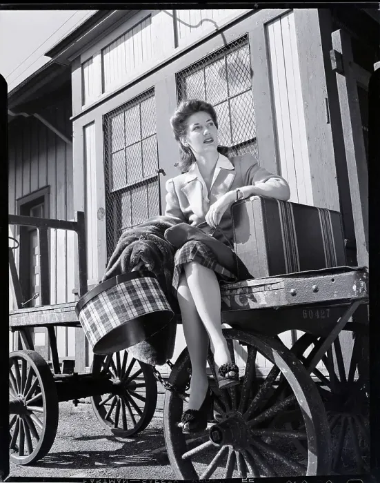 Framed Print : Woman Sitting on Luggage Trolley Framed Print : Woman Sitting on Luggage Trolley