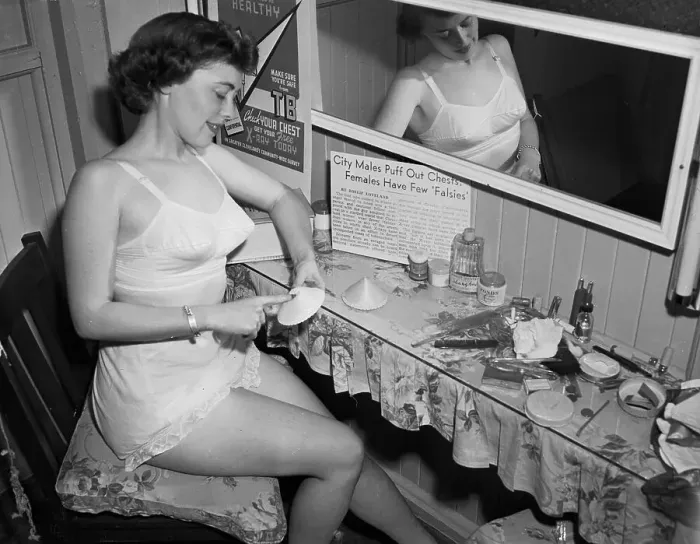 Framed Print : Woman Sitting at Vanity Table