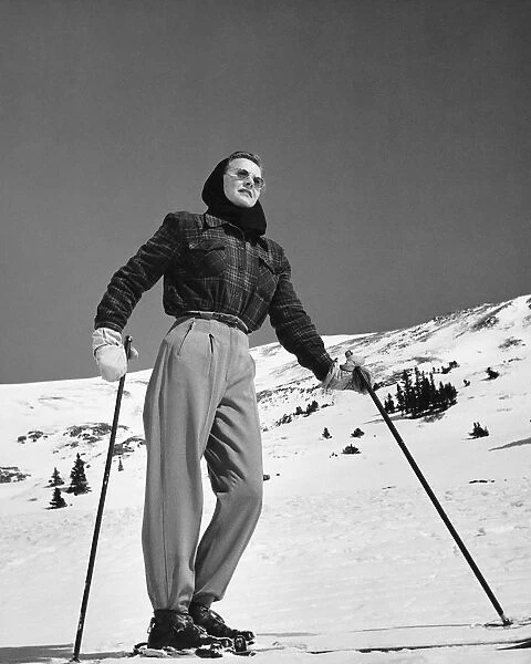Woman skier standing on slopes