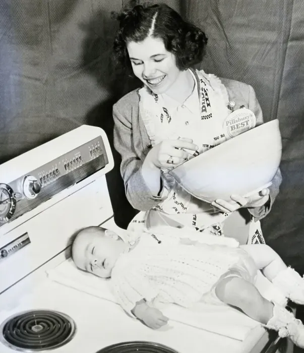Framed Print : Woman With Sleeping Daughter During Cooking Competition Framed Print : Woman With Sleeping Daughter During Cooking Competition