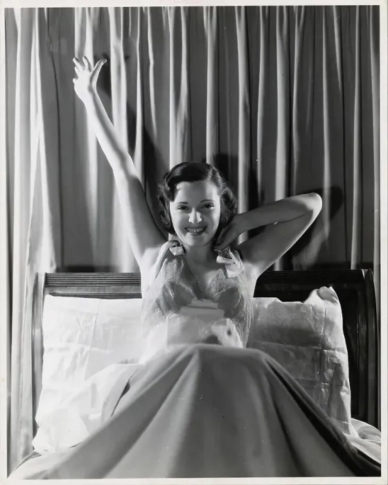 Framed Print : Woman Smiling and Stretching in Bed