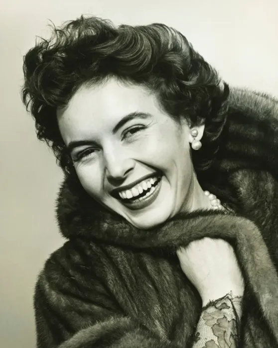 Framed Print : Woman smiling in studio, (B&W), portrait Framed Print : Woman smiling in studio, (B&W), portrait