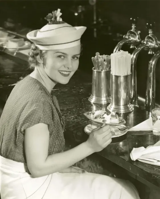Framed Print : Woman at soda fountain with banana split Framed Print : Woman at soda fountain with banana split