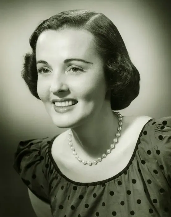 Framed Print : Woman in spotted dress posing in studio, (B&W), (Close-up), (Portrait) Framed Print : Woman in spotted dress posing in studio, (B&W), (Close-up), (Portrait)