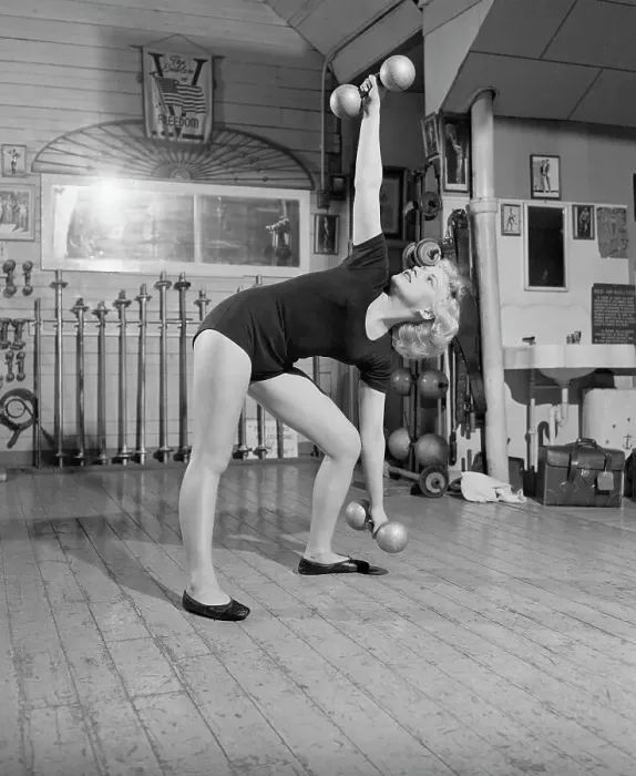 Framed Print : Woman Standing Exercising With Barbells Framed Print : Woman Standing Exercising With Barbells