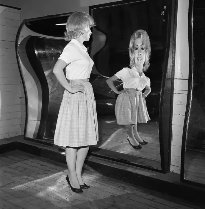 Framed Print : Woman Standing at Fun House Mirror