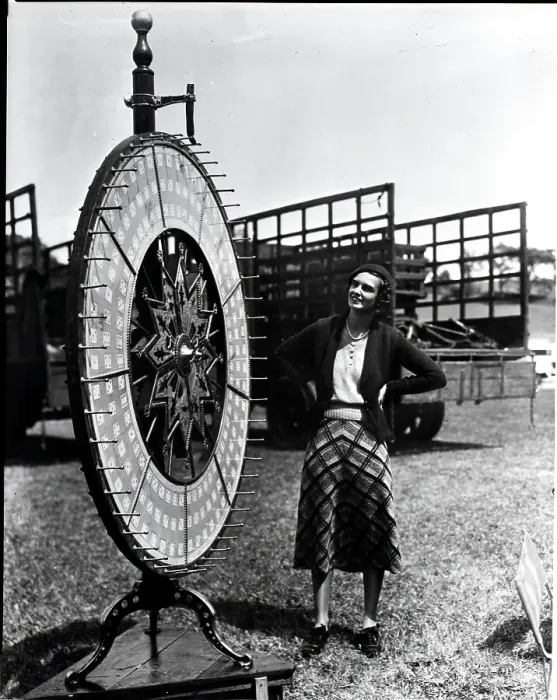 Framed Print : Woman Standing Near Wheel Of Fortune Framed Print : Woman Standing Near Wheel Of Fortune