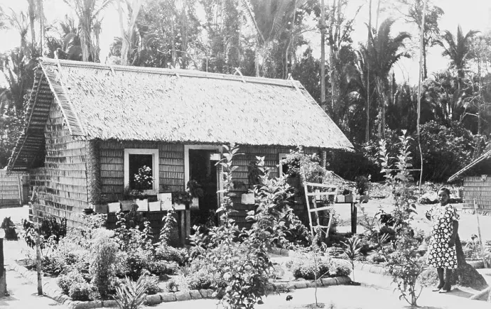 Framed Print : Woman Standing Outside a Cottage Framed Print : Woman Standing Outside a Cottage