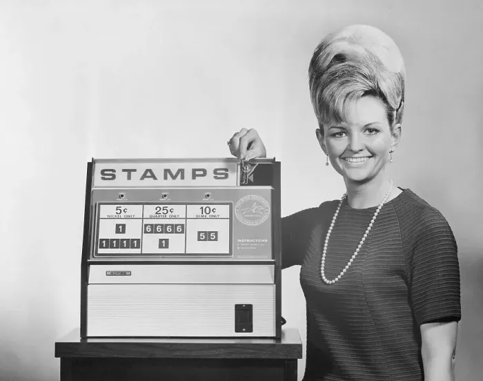 Framed Print : Woman Standing by Stamp Machine Framed Print : Woman Standing by Stamp Machine