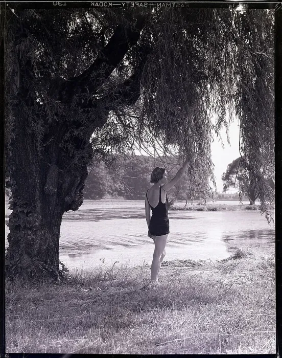 Framed Print : Woman Standing Under a Tree Framed Print : Woman Standing Under a Tree