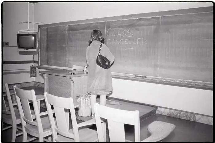 Framed Print : Woman Stands in Empty Classroom with Note Framed Print : Woman Stands in Empty Classroom with Note