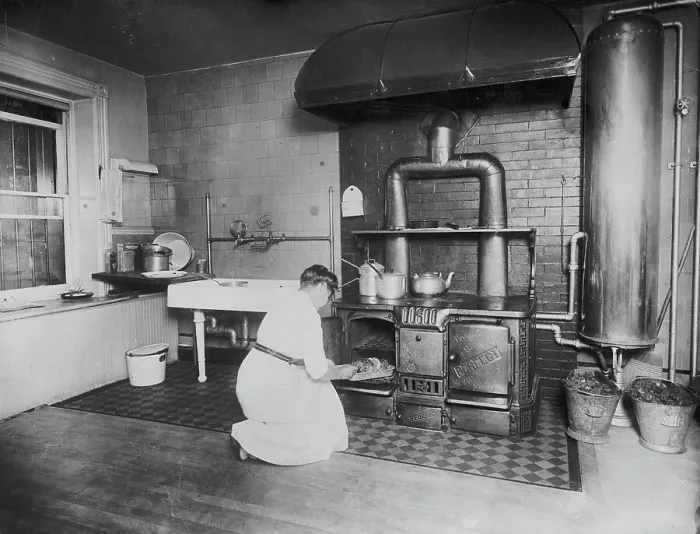 Framed Print : Woman Stooping to Check Oven Recipe in Kitchen Framed Print : Woman Stooping to Check Oven Recipe in Kitchen