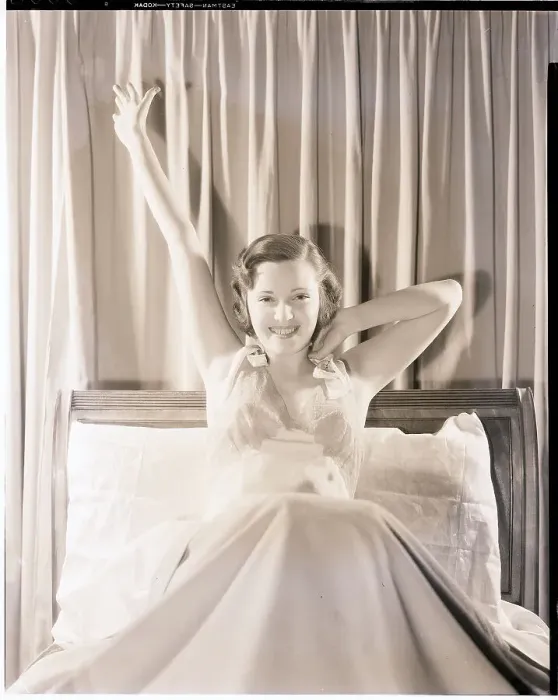 Framed Print : Woman Stretching in Bed Framed Print : Woman Stretching in Bed
