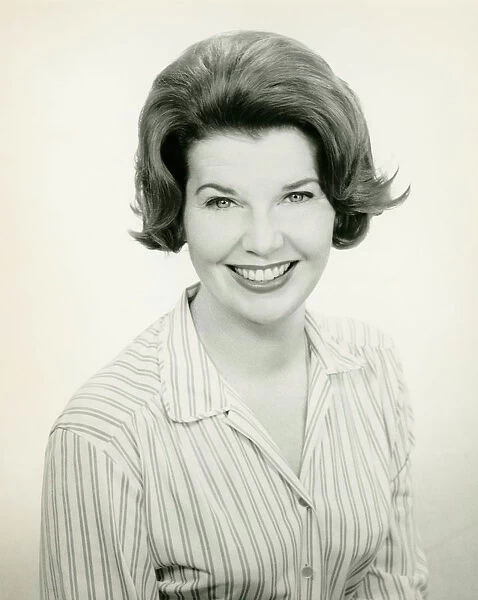 Woman in striped blouse smiling, (B&W), (Portrait)