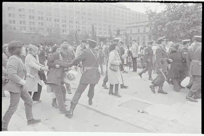 Framed Print : Woman Struggling with Police Officer Framed Print : Woman Struggling with Police Officer