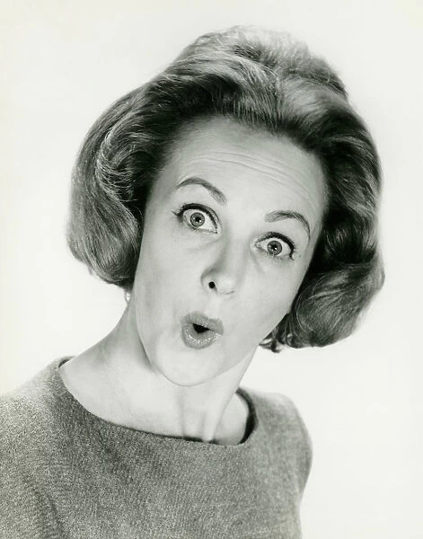 Woman with surprised expression, posing in studio, (B&W), (Portrait)