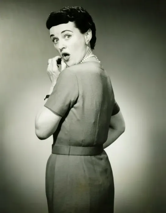Framed Print : Woman with surprised look in studio, (B&W), portrait Framed Print : Woman with surprised look in studio, (B&W), portrait