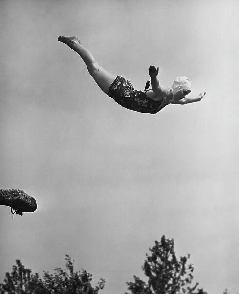 Woman swan diving