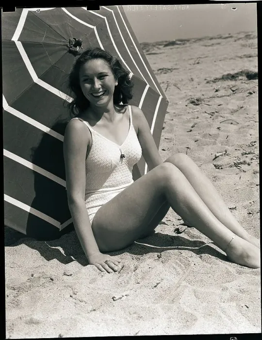 Framed Print : Woman in Swimsuit Seated Framed Print : Woman in Swimsuit Seated