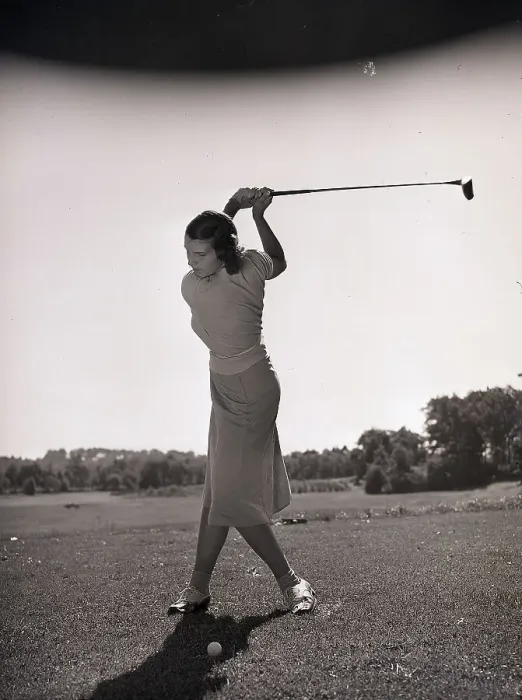 Framed Print : Woman Swinging a Golf Club Framed Print : Woman Swinging a Golf Club
