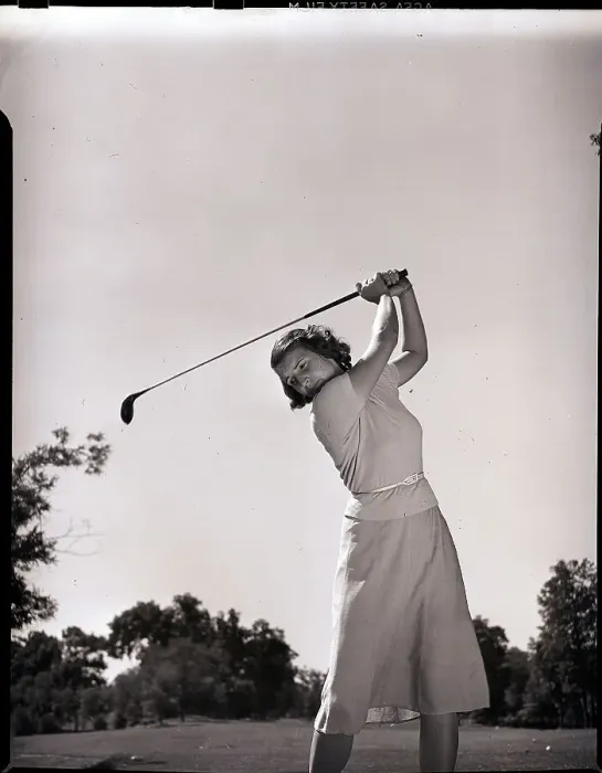 Framed Print : Woman Swinging Golf Club Framed Print : Woman Swinging Golf Club