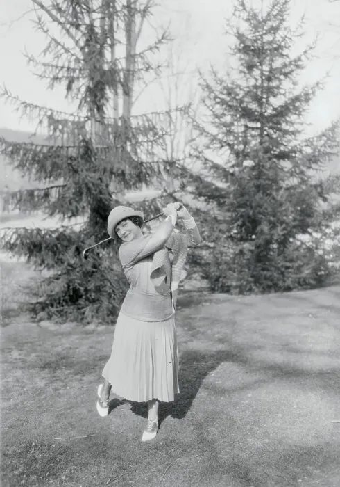 Framed Print : Woman Swinging a Golf Club Framed Print : Woman Swinging a Golf Club