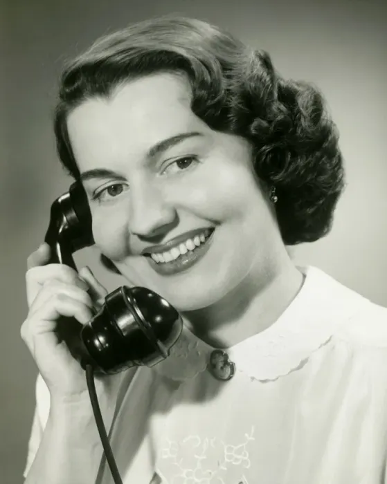 Framed Print : Woman talking on phone, close-up, studio shot Framed Print : Woman talking on phone, close-up, studio shot