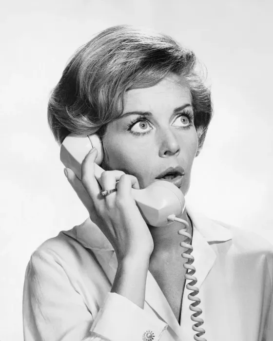 Framed Print : Woman talking on phone, looking surprised Framed Print : Woman talking on phone, looking surprised