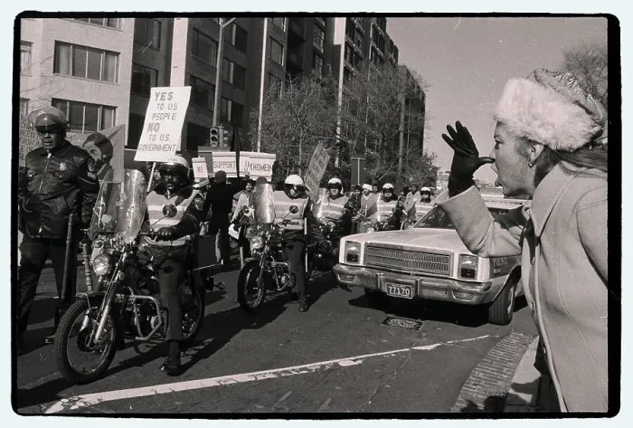 Framed Print : Woman Thumbing Nose at Moslem Protesters