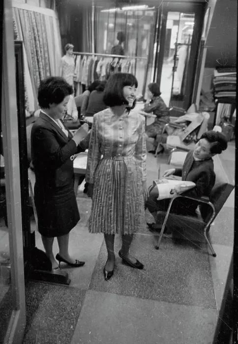 Framed Print : Woman Trying on Dress Framed Print : Woman Trying on Dress