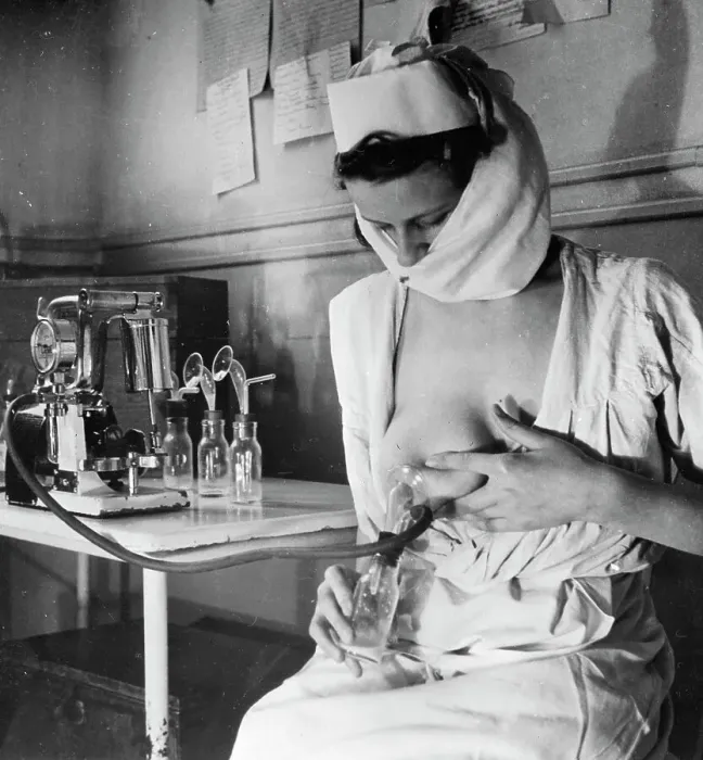 Framed Print : Woman Uses Apparatus To Draw Breast Milk Framed Print : Woman Uses Apparatus To Draw Breast Milk