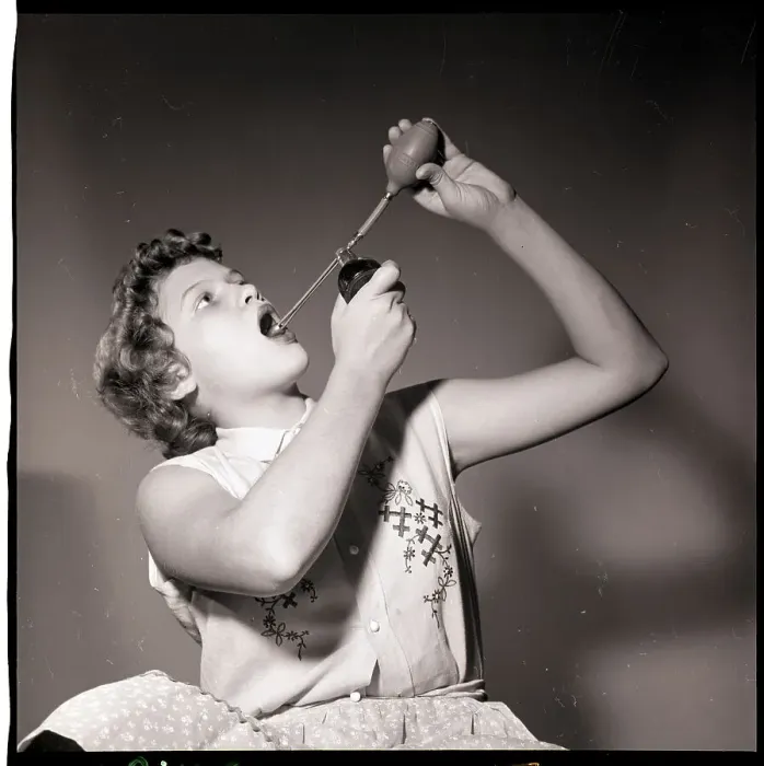 Framed Print : Woman Using an Atomizer Framed Print : Woman Using an Atomizer