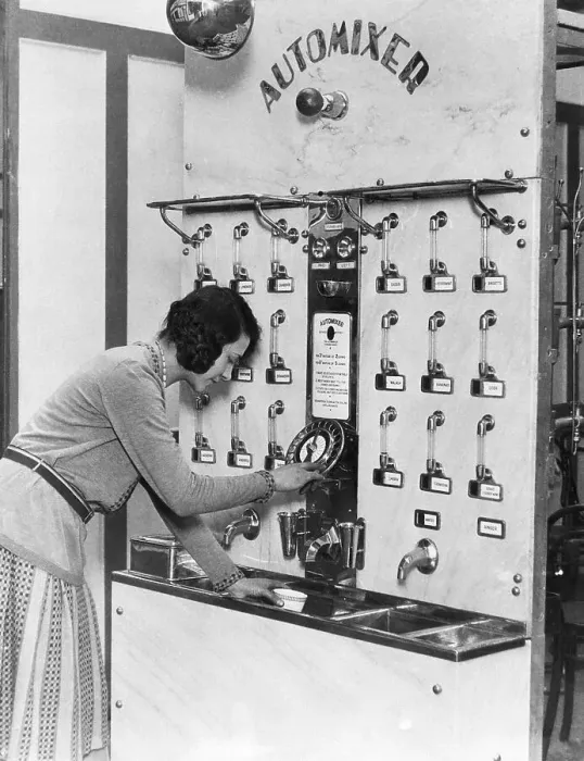 Framed Print : Woman Using Automated Cocktail Mixer