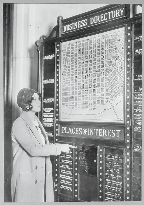 Framed Print : Woman Using an Electronic Business Directory Framed Print : Woman Using an Electronic Business Directory