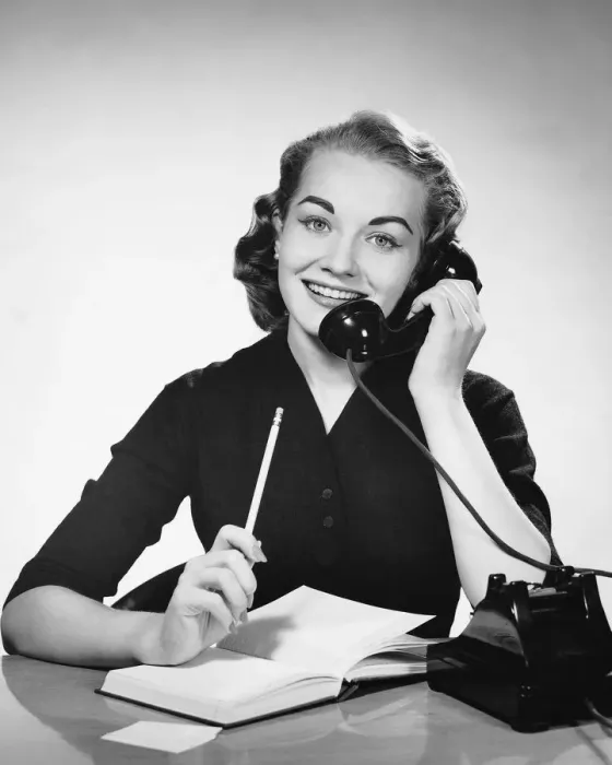 Framed Print : Woman using phone and holding pencil Framed Print : Woman using phone and holding pencil
