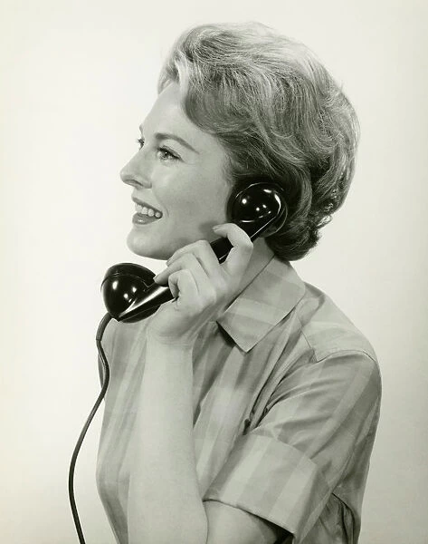 Woman using phone, posing in studio, (B&W), (Close-up)