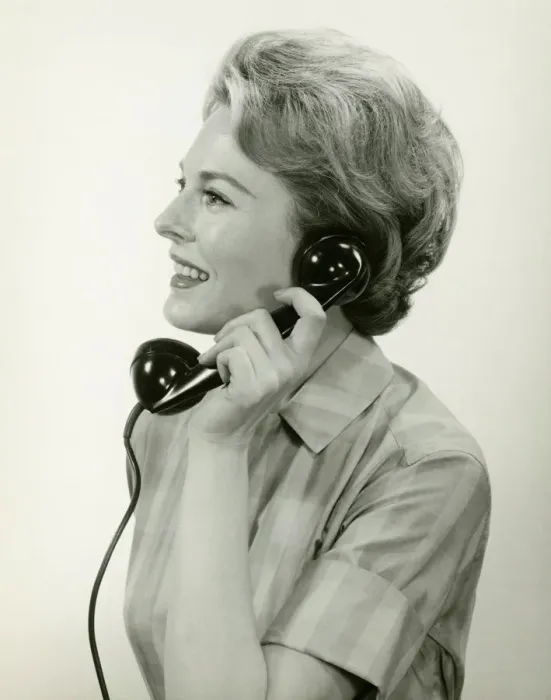 Framed Print : Woman using phone, posing in studio, (B&W), (Close-up) Framed Print : Woman using phone, posing in studio, (B&W), (Close-up)