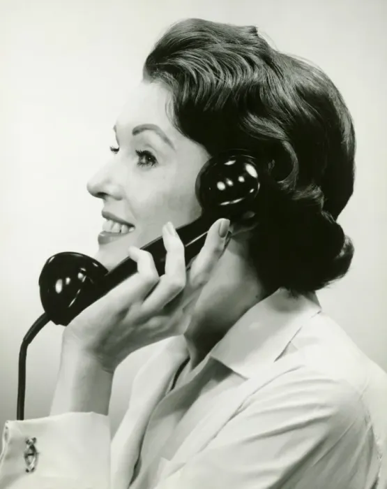 Framed Print : Woman using phone, posing in studio, (B&W), (Close-up) Framed Print : Woman using phone, posing in studio, (B&W), (Close-up)