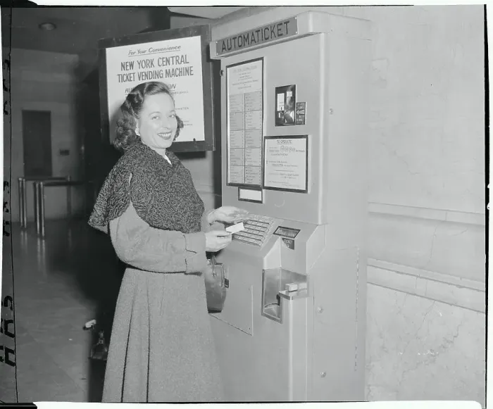 Framed Print : Woman Using a Ticket Vending Machine